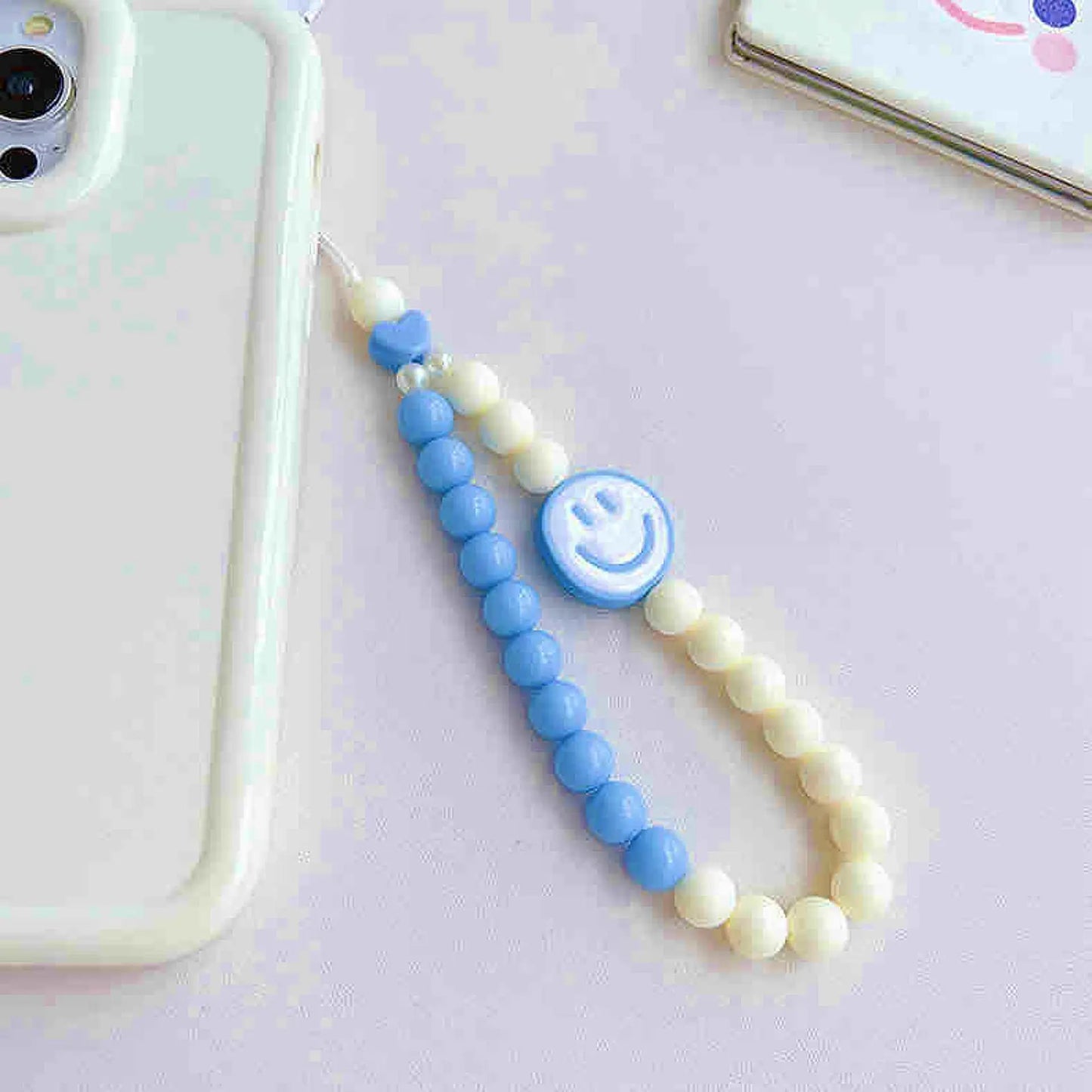 Phone charm with smiley