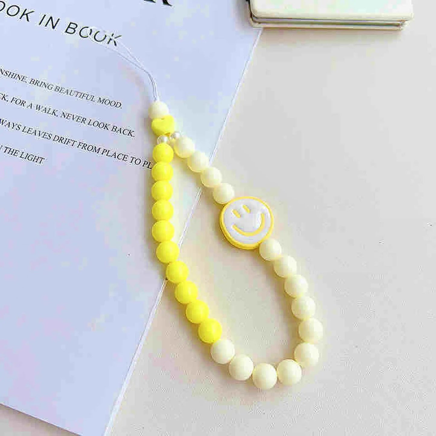 Phone charm with smiley