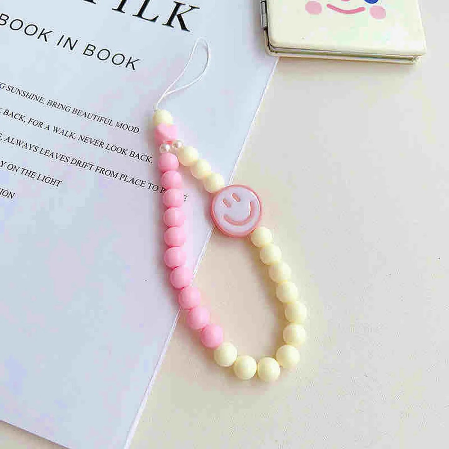 Phone charm with smiley